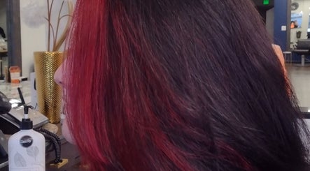 Vibrant red hair styled by Chaughn at Allure Salon Suites, Hot Springs, Arkansas, US.