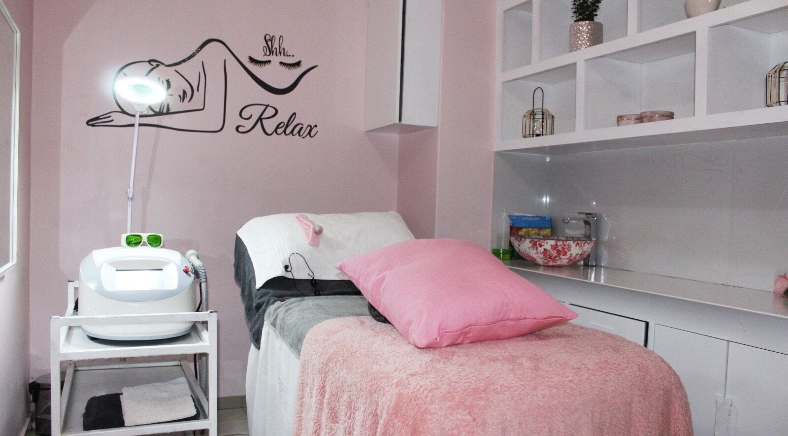 Elegant treatment room at Laser Hair Removal Lansdowne/Rosa beauty spa, Cape Town, Western Cape, ZA, with cozy decor.