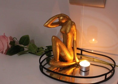 Golden statue with rose and candle at Laser Hair Removal Lansdowne/Rosa beauty spa, Cape Town, Western Cape, ZA.