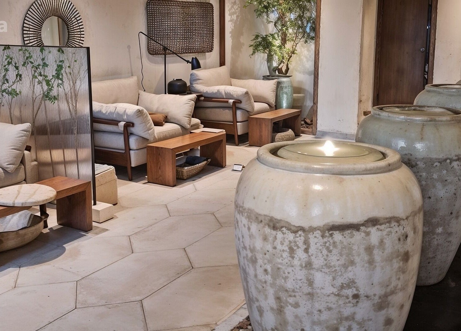 Relaxing reception area at Kaia Spa - Ar Rayyan, Riyadh, with plush seating and ambient lighting.
