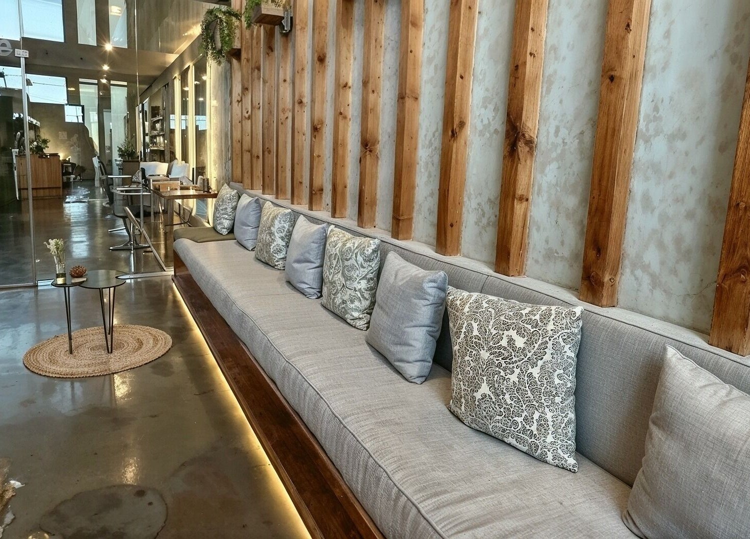 Elegant seating area at Kaia Spa - Ar Rayyan, Riyadh, Riyadh Province, SA. Cozy cushions on a wooden bench.
