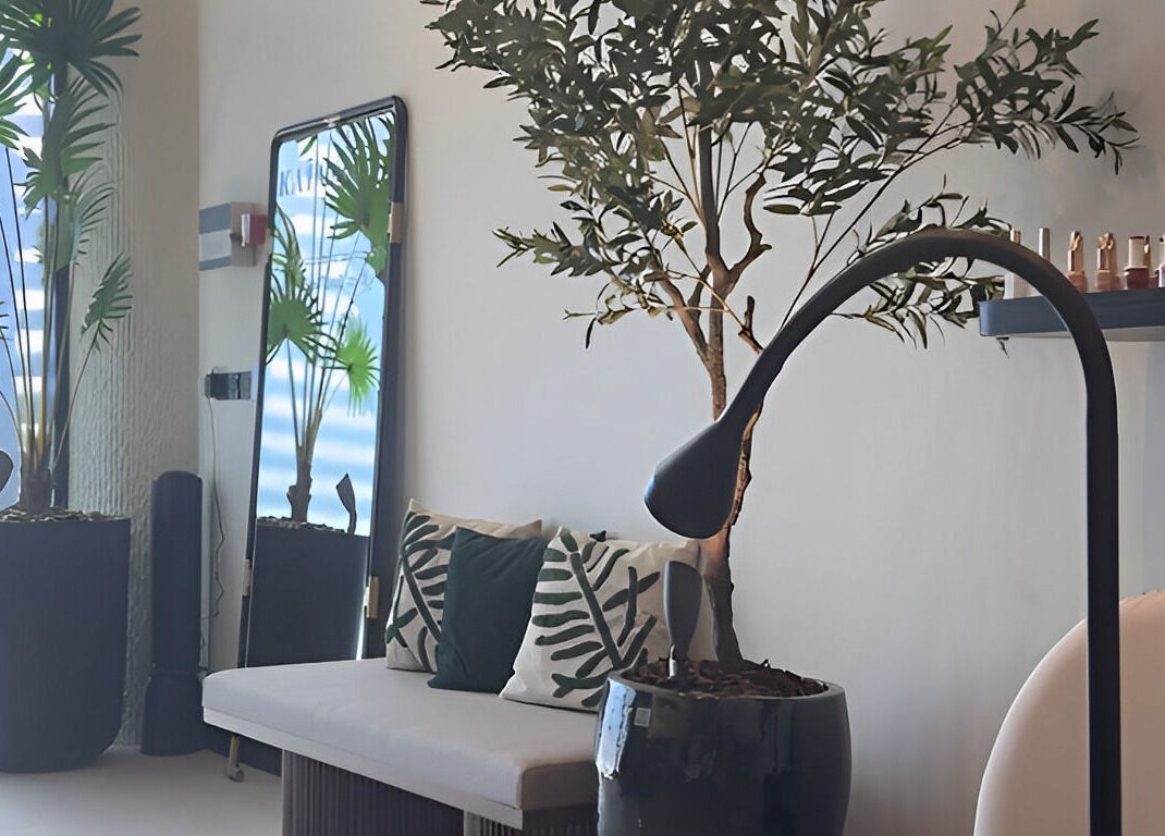 Elegant interior of Kaia Spa - Ar Rayyan in Riyadh with modern decor and lush plants.