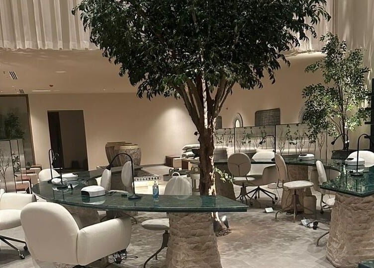 Elegant salon area at Kaia Spa - Al Malqa, Riyadh, Riyadh Province, SA, featuring plush chairs and green tables.