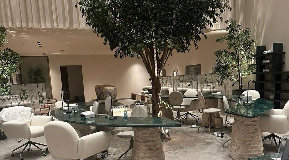 Elegant salon area at Kaia Spa - Al Malqa, Riyadh, Riyadh Province, SA, featuring plush chairs and green tables.