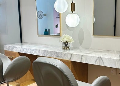 Modern marble vanity and seating at The Glam Studio | ذا جلام ستوديو, Riyadh, Riyadh Province, SA.