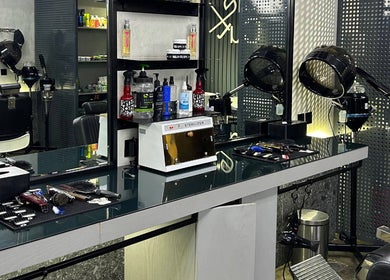 Modern interior of Double Cut Barbershop | صالون دبل كت in Riyadh, Riyadh Province, SA with grooming tools.