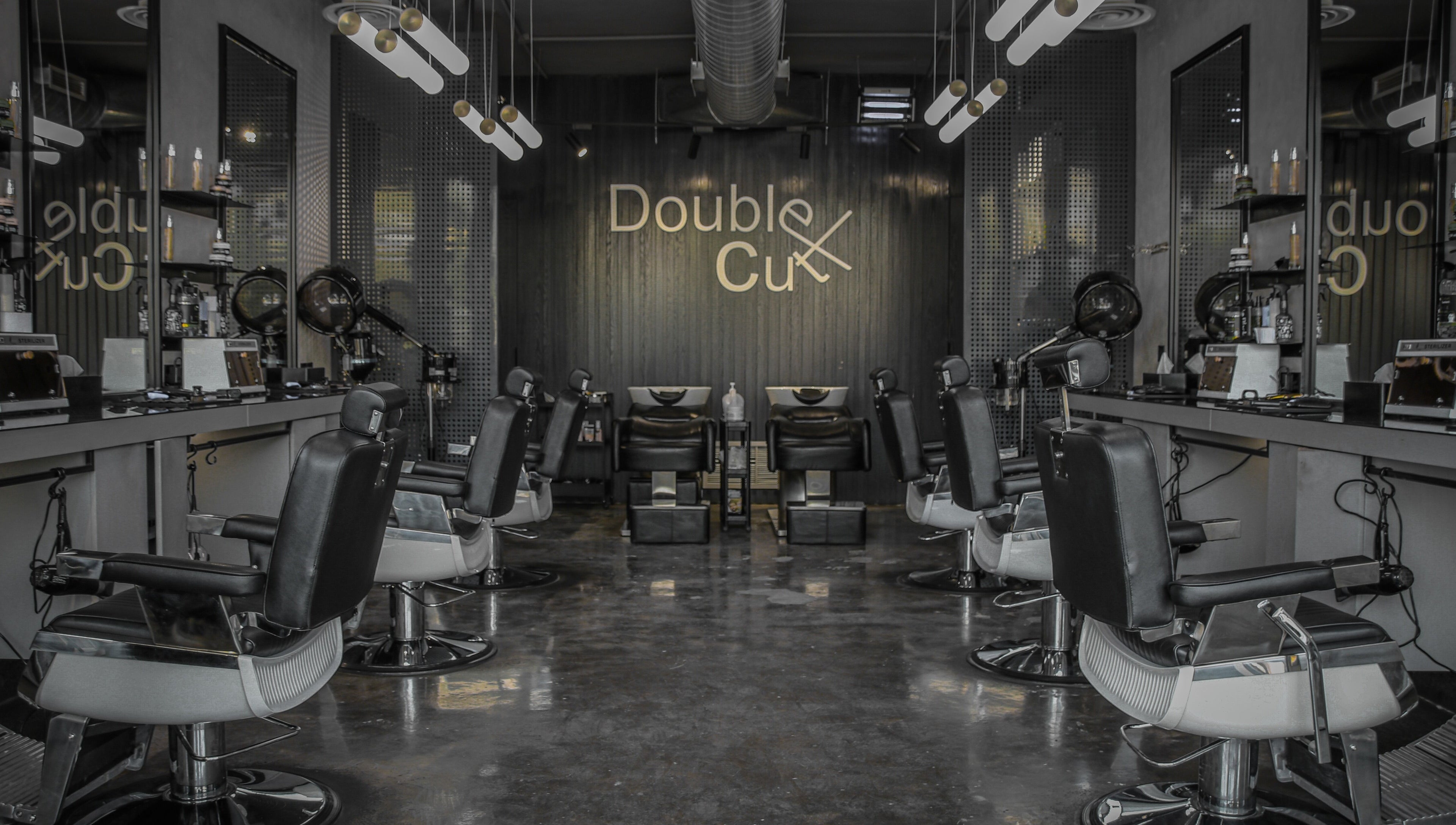 Sleek interior of Double Cut Barbershop | صالون دبل كت in Riyadh, Riyadh Province, SA with modern barber chairs.
