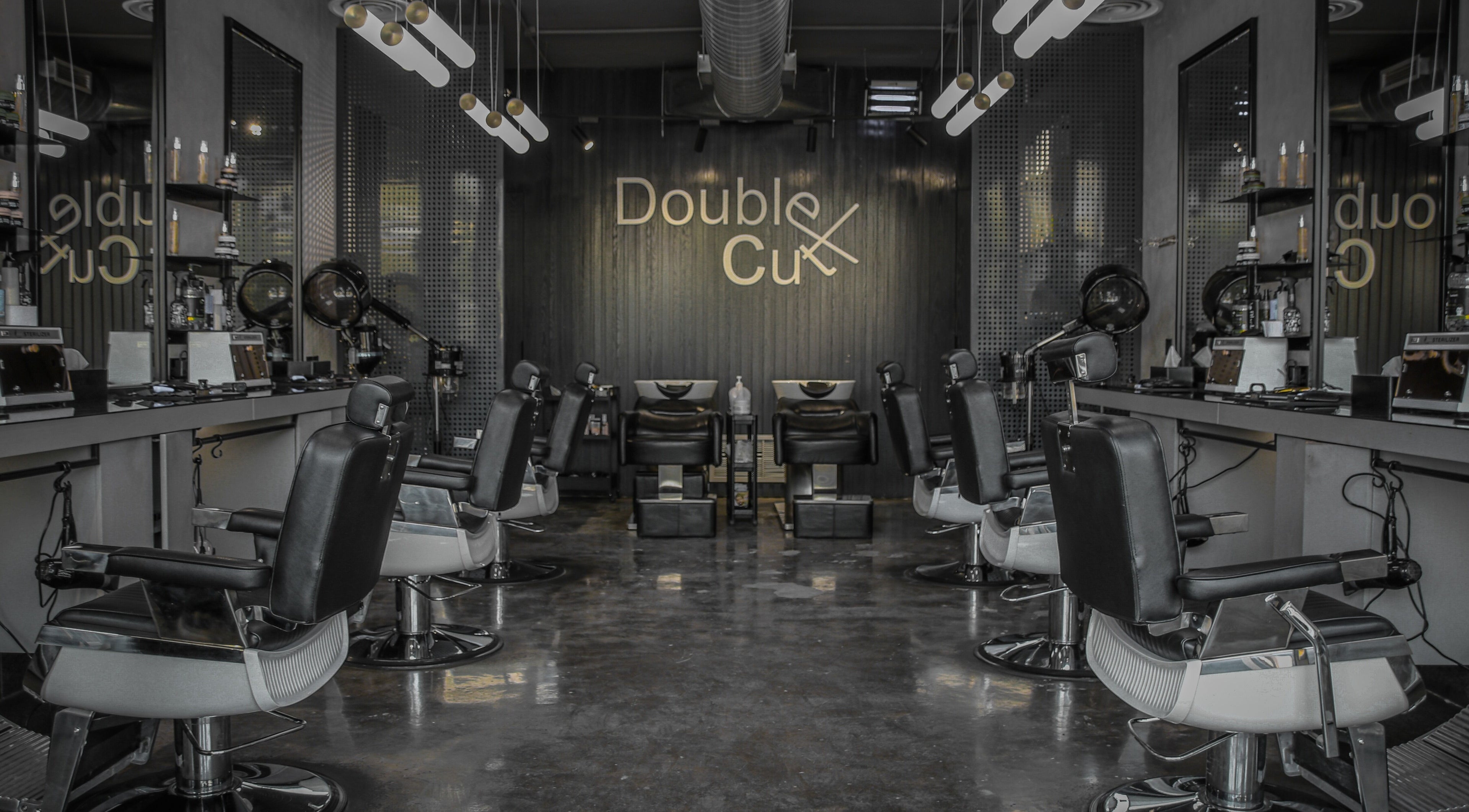 Sleek interior of Double Cut Barbershop | صالون دبل كت in Riyadh, Riyadh Province, SA with modern barber chairs.