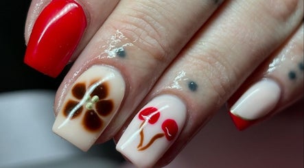 Stylish nail art with floral design at Beauty Duties, Rawreth, England, GB.