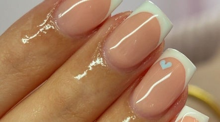 French manicure with heart design at Beauty Duties, Rawreth, England, GB. Elegant and stylish nail art.