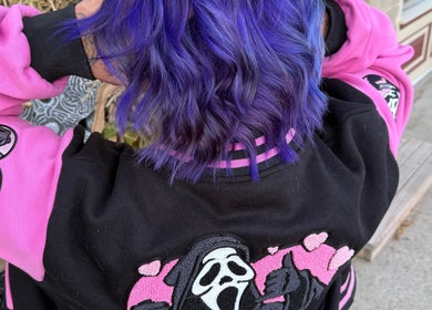 Vibrant purple hair styled at Myrna Hastings Haair, Indian Head, Saskatchewan, CA, showing unique dye work.