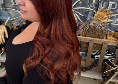 Elegant red hair styled into waves at Myrna Hastings Haair, Indian Head, Saskatchewan, CA.