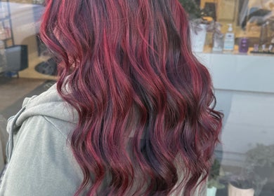 Vibrant crimson waves styled at Myrna Hastings Haair, Indian Head, Saskatchewan, CA.