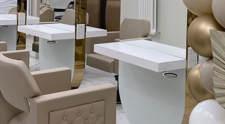 Stylish interior at Laura Mc Ginley Hairdressing, Strabane, Northern Ireland, GB showcasing modern salon chairs and mirrors.