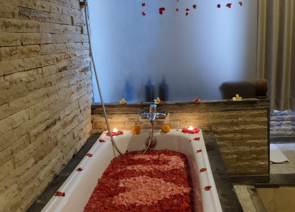 Luxurious flower-filled bathtub at Rituals Wellness Spa, Bali, Bali, ID, offering ultimate relaxation.