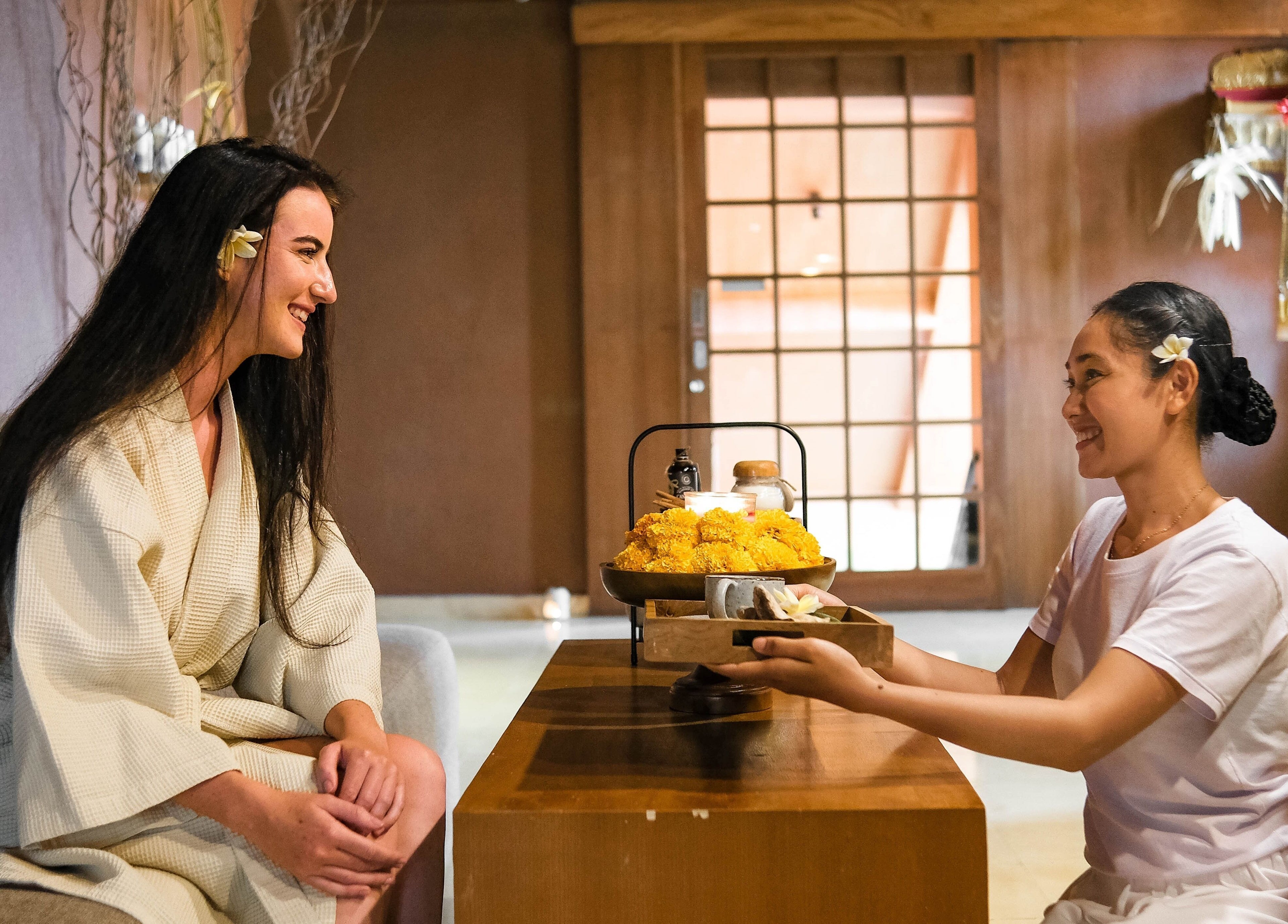 Guest receiving warm welcome at Rituals Wellness Spa, Bali, Bali, ID. Perfect ambiance for relaxation.