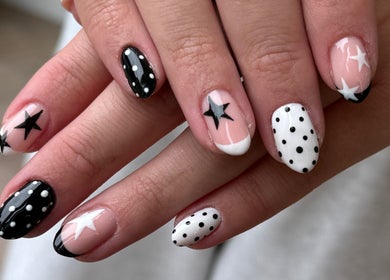 Stylish black and white star nail art by Manicured byLana in Uddingston, Scotland, GB.
