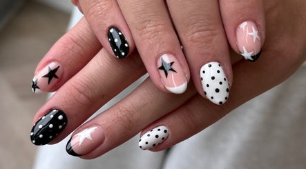 Stylish black and white star nail art by Manicured byLana in Uddingston, Scotland, GB.