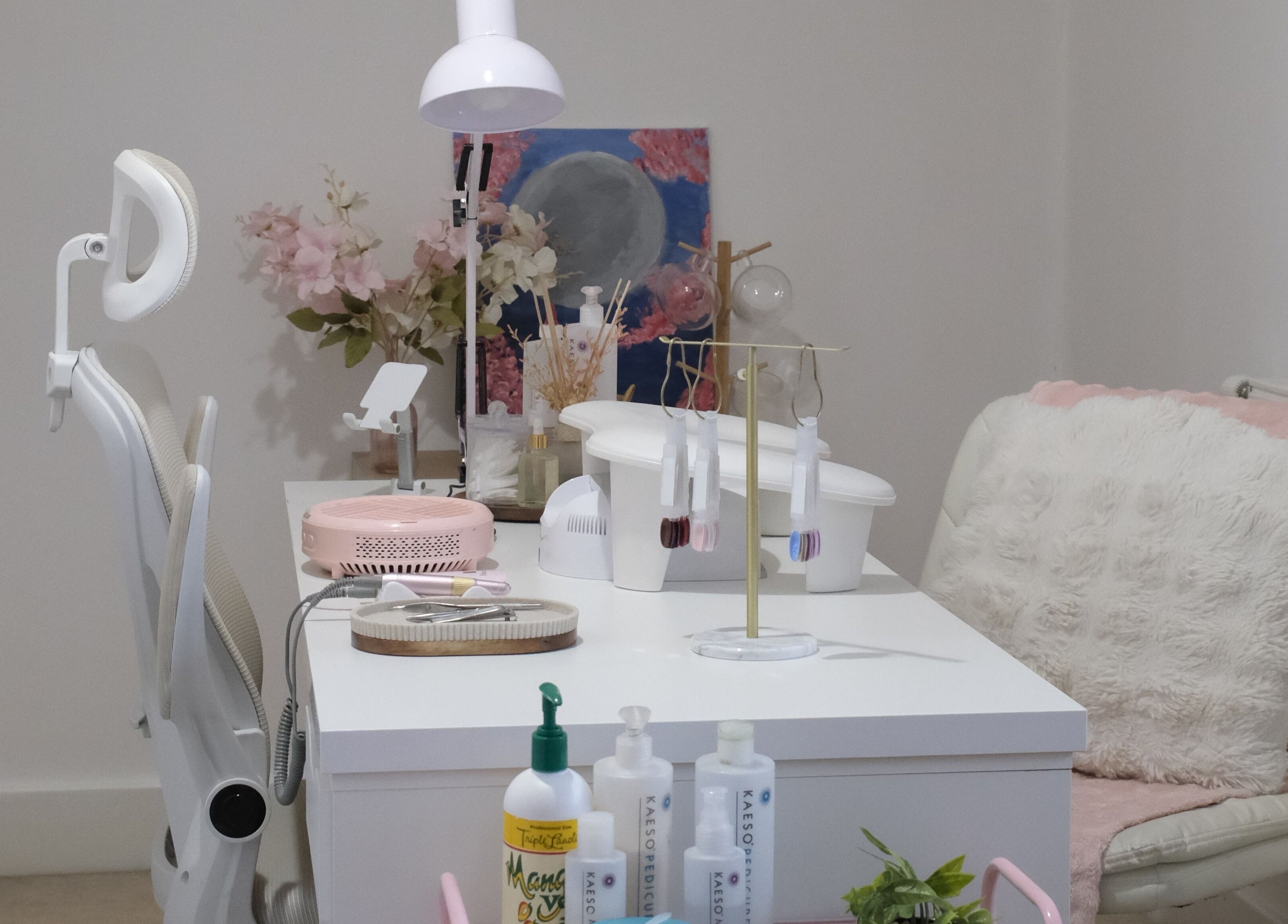 Stylish nail care station at LV Nails in Feltham, England, GB with modern decor and plush seating.