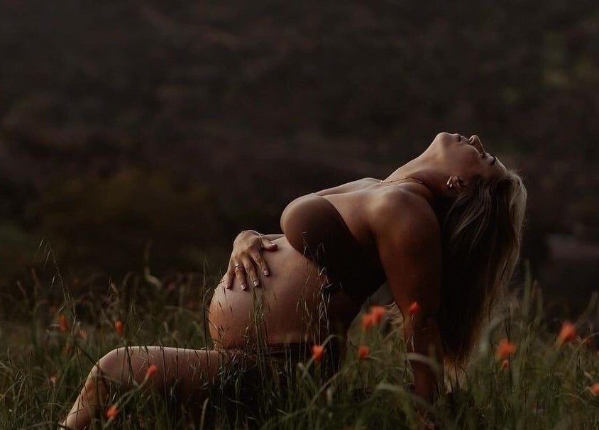 Pregnant woman enjoying sunset at Glow Tribe Spray Tanning, Glen Forrest, Western Australia, AU.