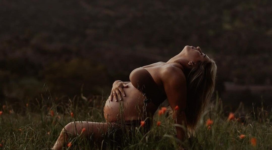 Pregnant woman enjoying sunset at Glow Tribe Spray Tanning, Glen Forrest, Western Australia, AU.