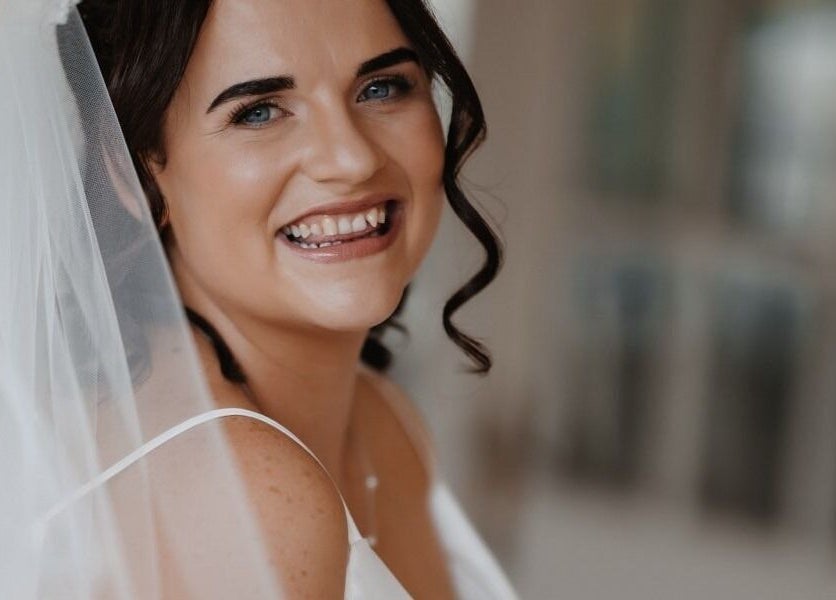 Happy bride with veil, styled by Glow Tribe Spray Tanning, Glen Forrest, Western Australia, AU.