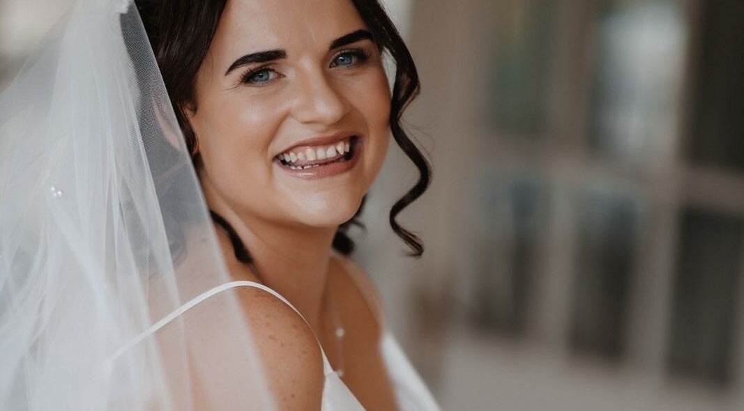 Happy bride with veil, styled by Glow Tribe Spray Tanning, Glen Forrest, Western Australia, AU.