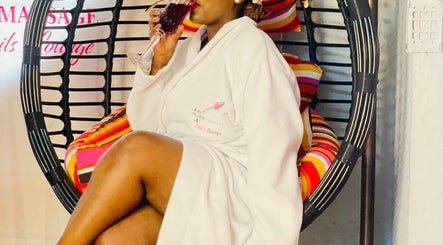 Guest enjoying a drink in a cozy robe at Bohl Squared Beauty Spa, Springs, Gauteng, ZA.