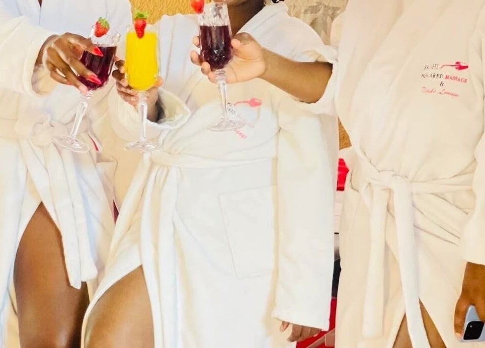 Guests in robes toasting with drinks at Bohl Squared Beauty Spa, Springs, Gauteng, ZA.