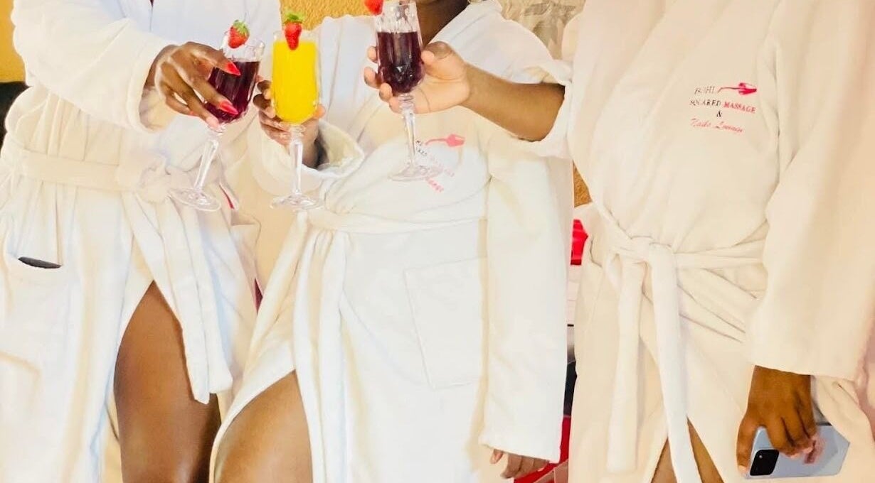 Guests in robes toasting with drinks at Bohl Squared Beauty Spa, Springs, Gauteng, ZA.