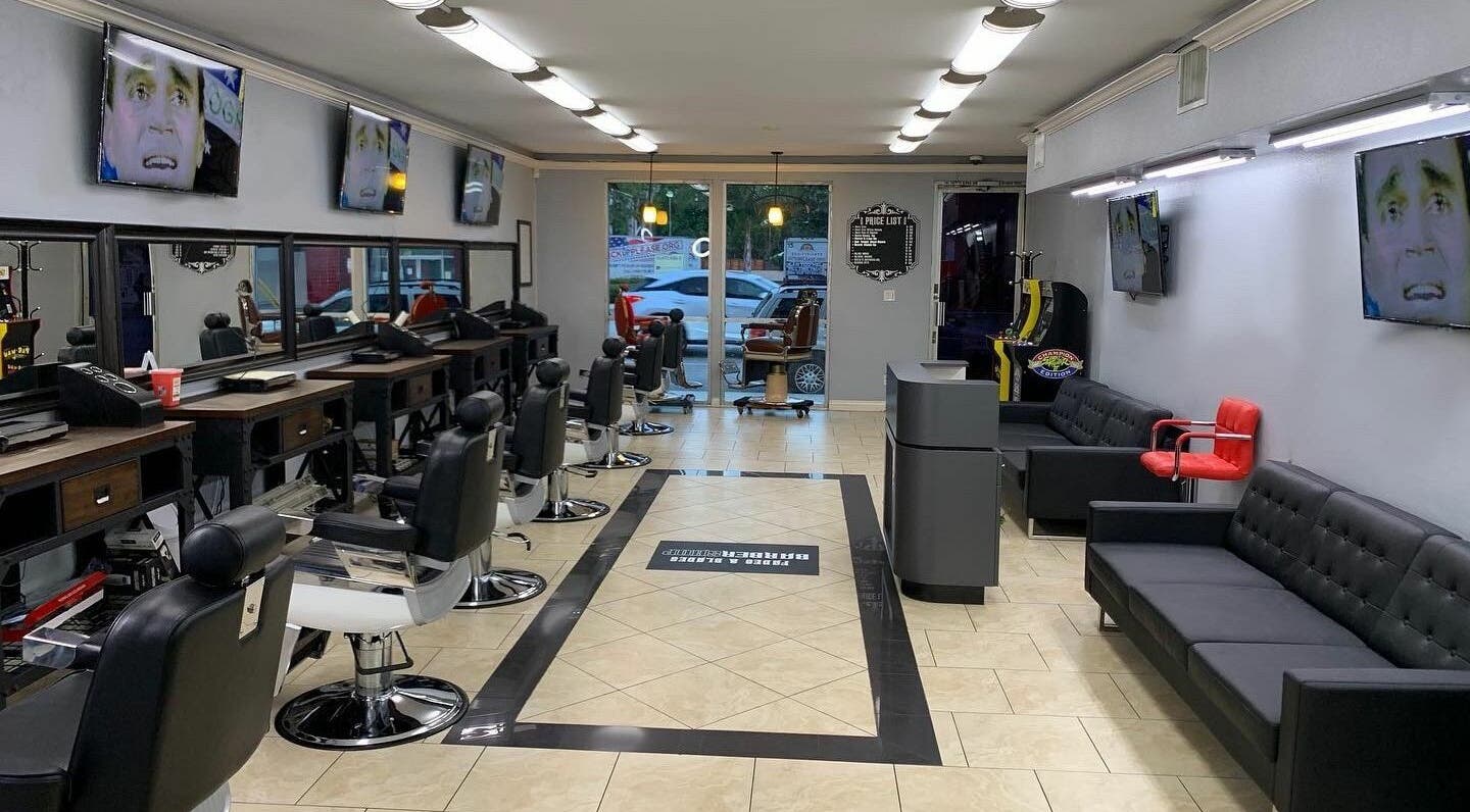 Modern interior of Fades & Blades Valley Glen, Los Angeles, California, US with stylish barber chairs and decor.