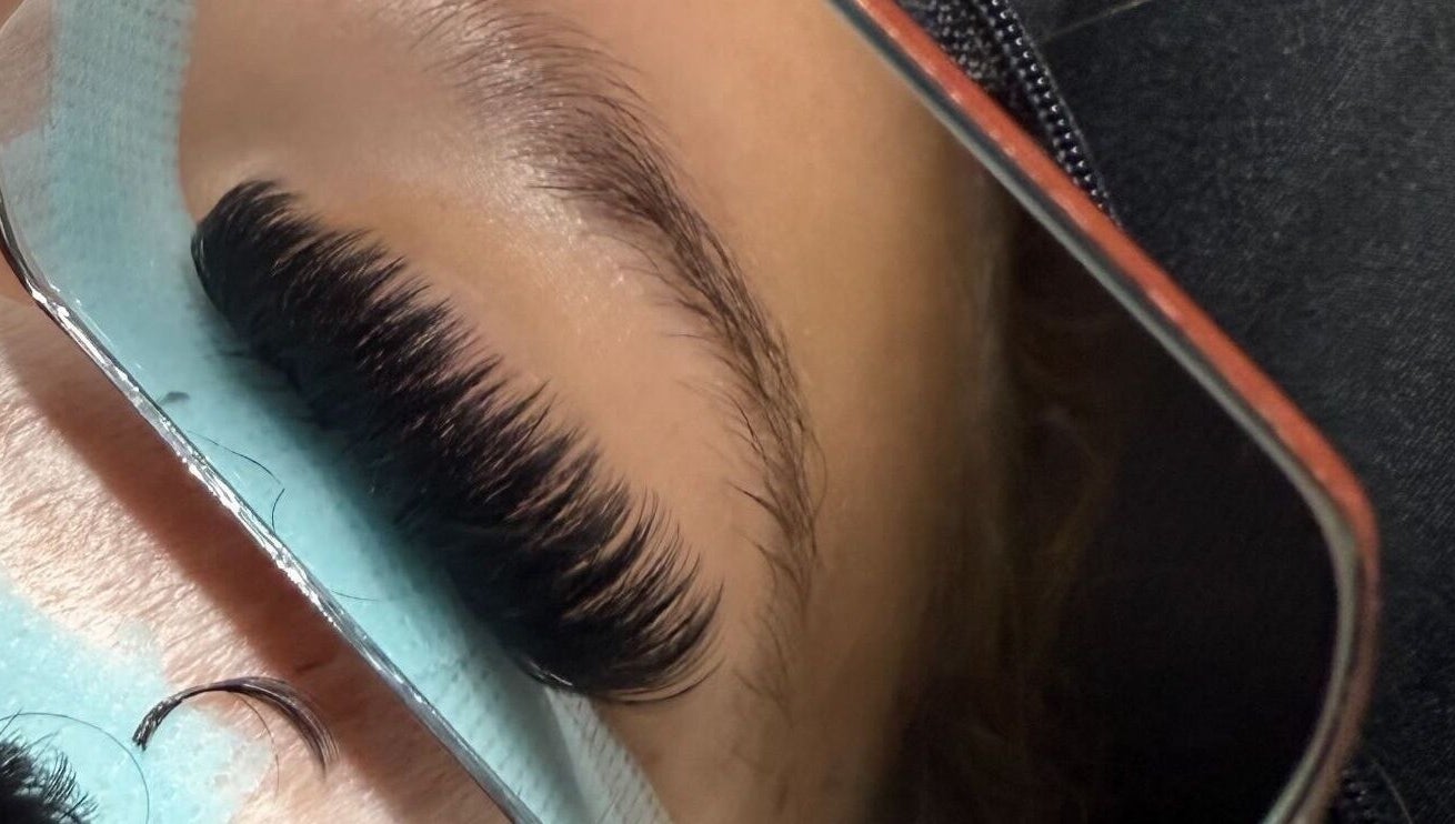 Close-up of eyelash extensions at Defined By Chlo, Pampisford, England, GB in a mirror reflection.