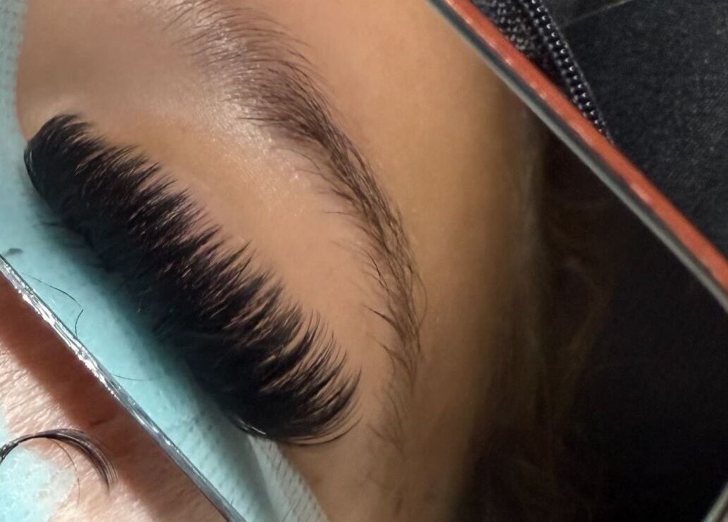 Close-up of eyelash extensions at Defined By Chlo, Pampisford, England, GB in a mirror reflection.