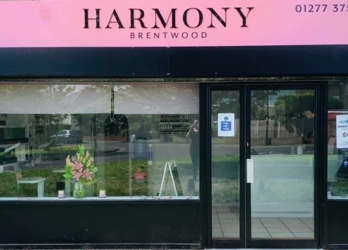 Front view of Harmony salon in Brentwood, England, GB, showcasing elegant storefront design.