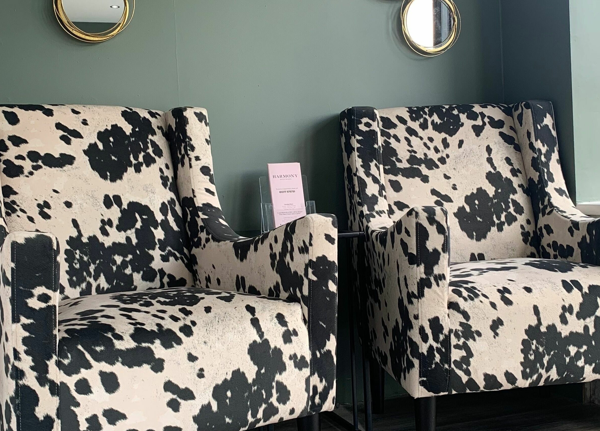 Stylish cowhide chairs in Harmony's Brentwood, England, GB venue offer cozy and chic relaxation spots.