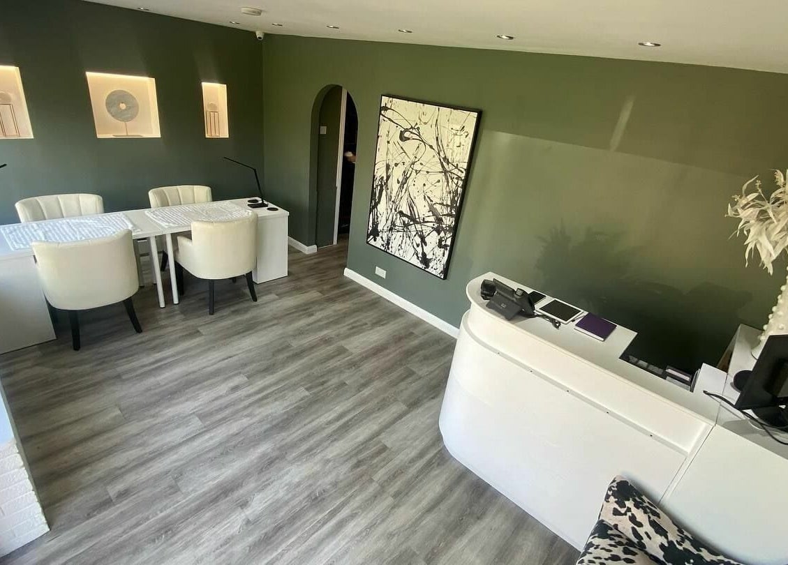 Modern reception area at Harmony, Brentwood, England, GB with stylish decor and comfortable seating.