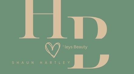 Hartley’s Beauty logo in green and beige, located in Lafayette, Louisiana, US.