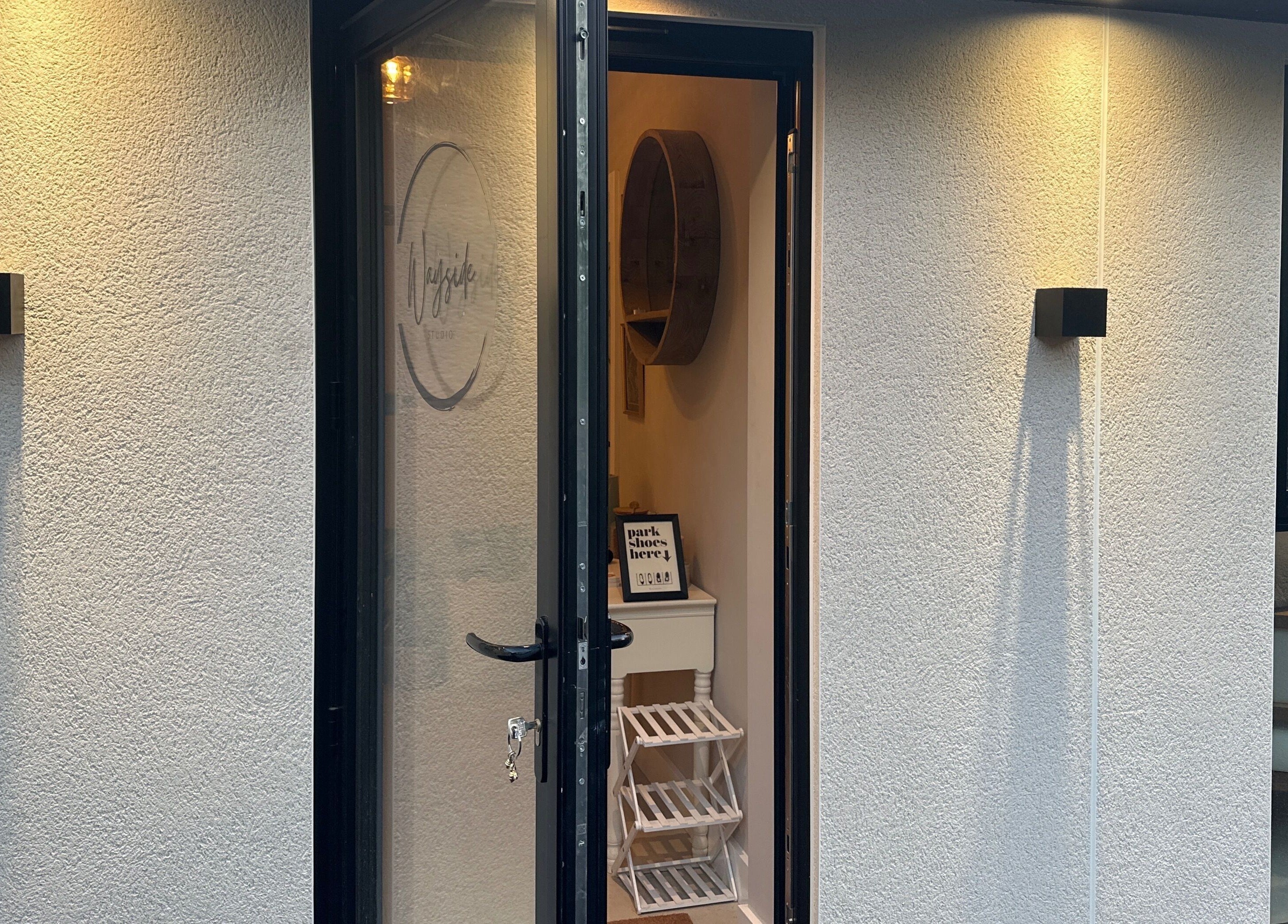 Entrance to Lily the Nail Tech in Wraxall, GB, warmly lit with a welcoming interior glimpse.
