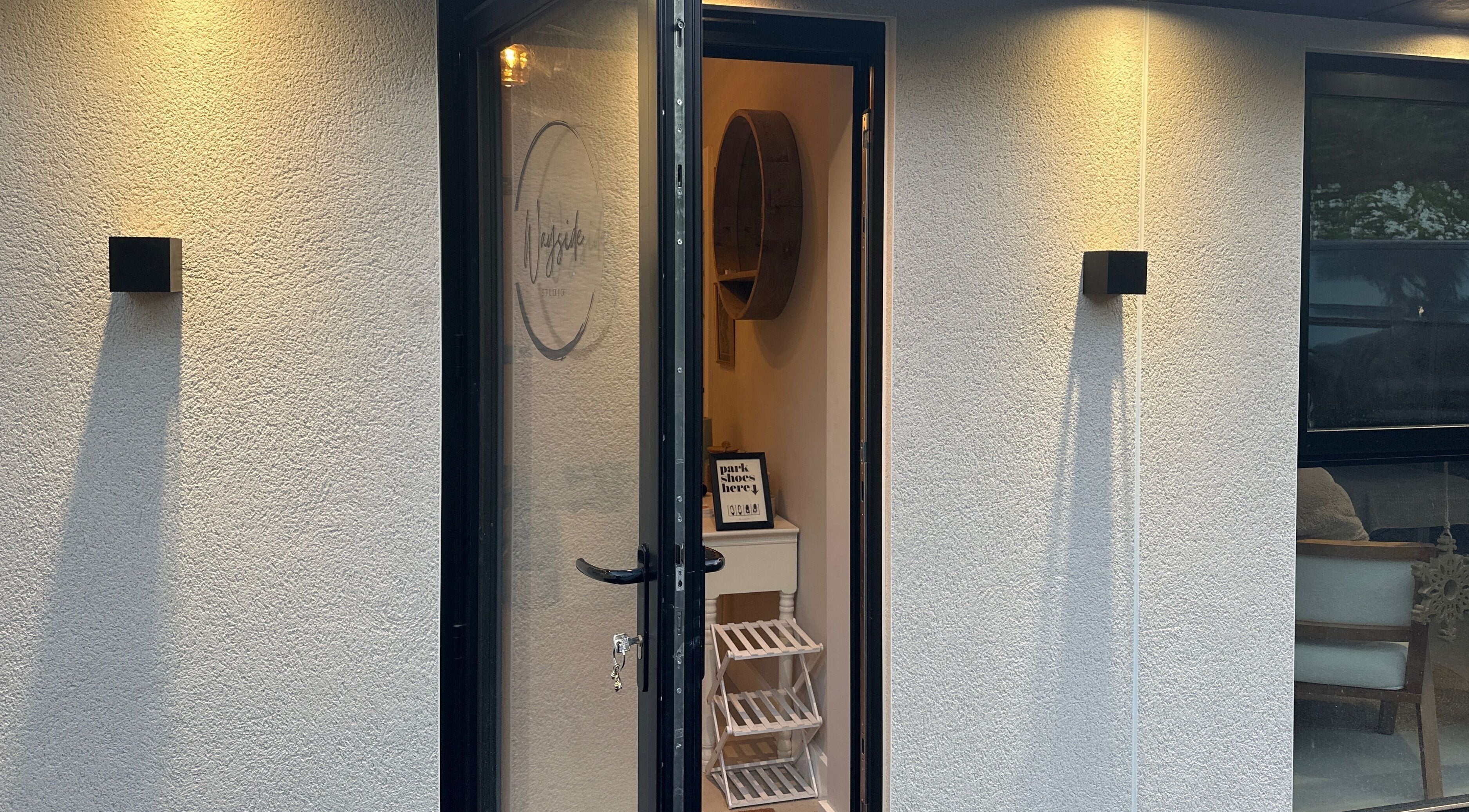 Entrance to Lily the Nail Tech in Wraxall, GB, warmly lit with a welcoming interior glimpse.