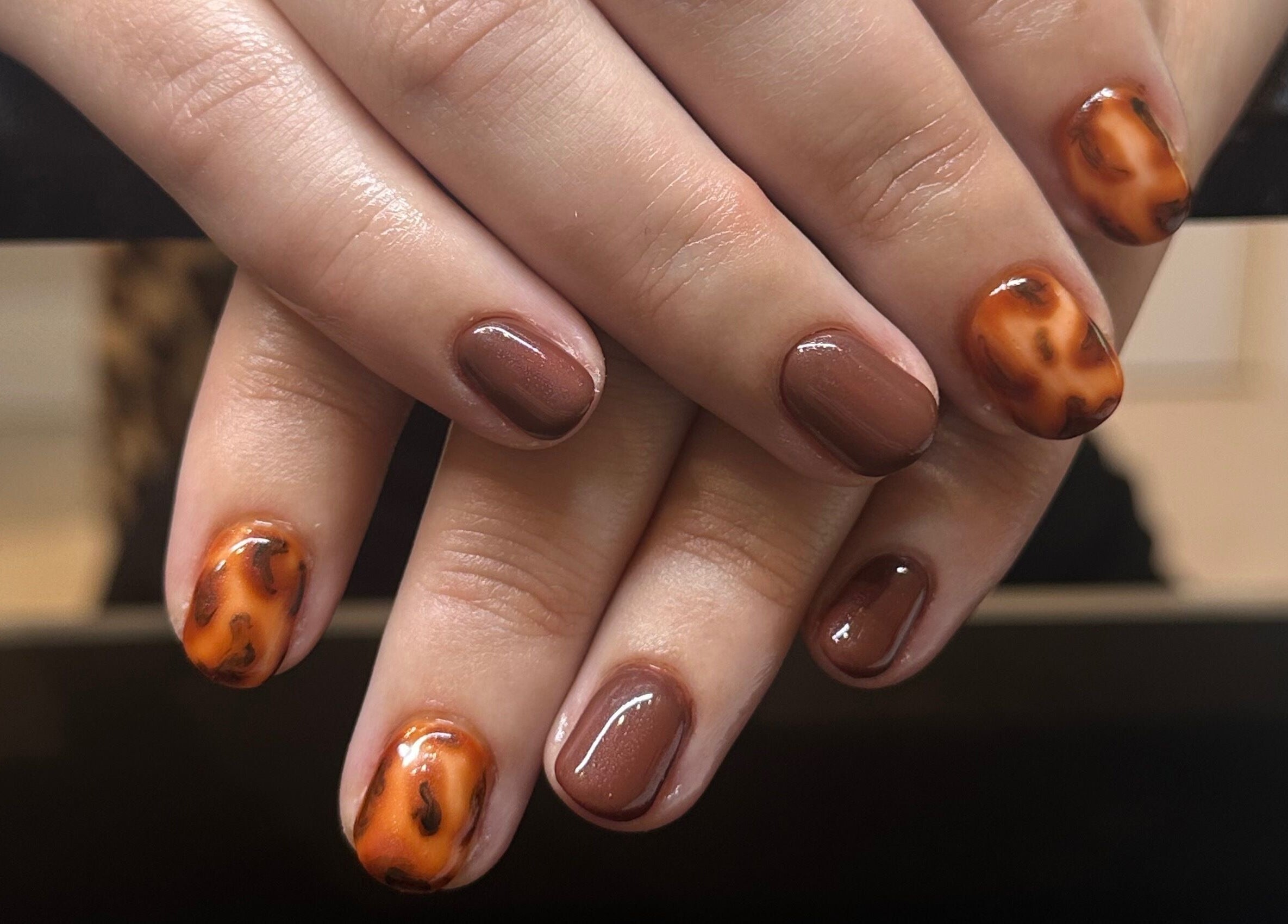 Elegant autumn nail design by Lily the Nail Tech in Wraxall, GB. Rich brown and tortoise shell pattern.