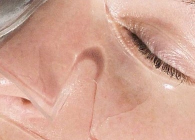 Close-up of a relaxing facial mask at Mnmlsm Beauty, Toronto, Ontario, CA for rejuvenated skin care.