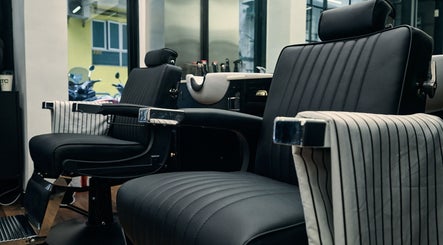 Elegant barber chairs at FOXHOUND Barbershop in Macao, MO offer comfort and style for a perfect grooming experience.