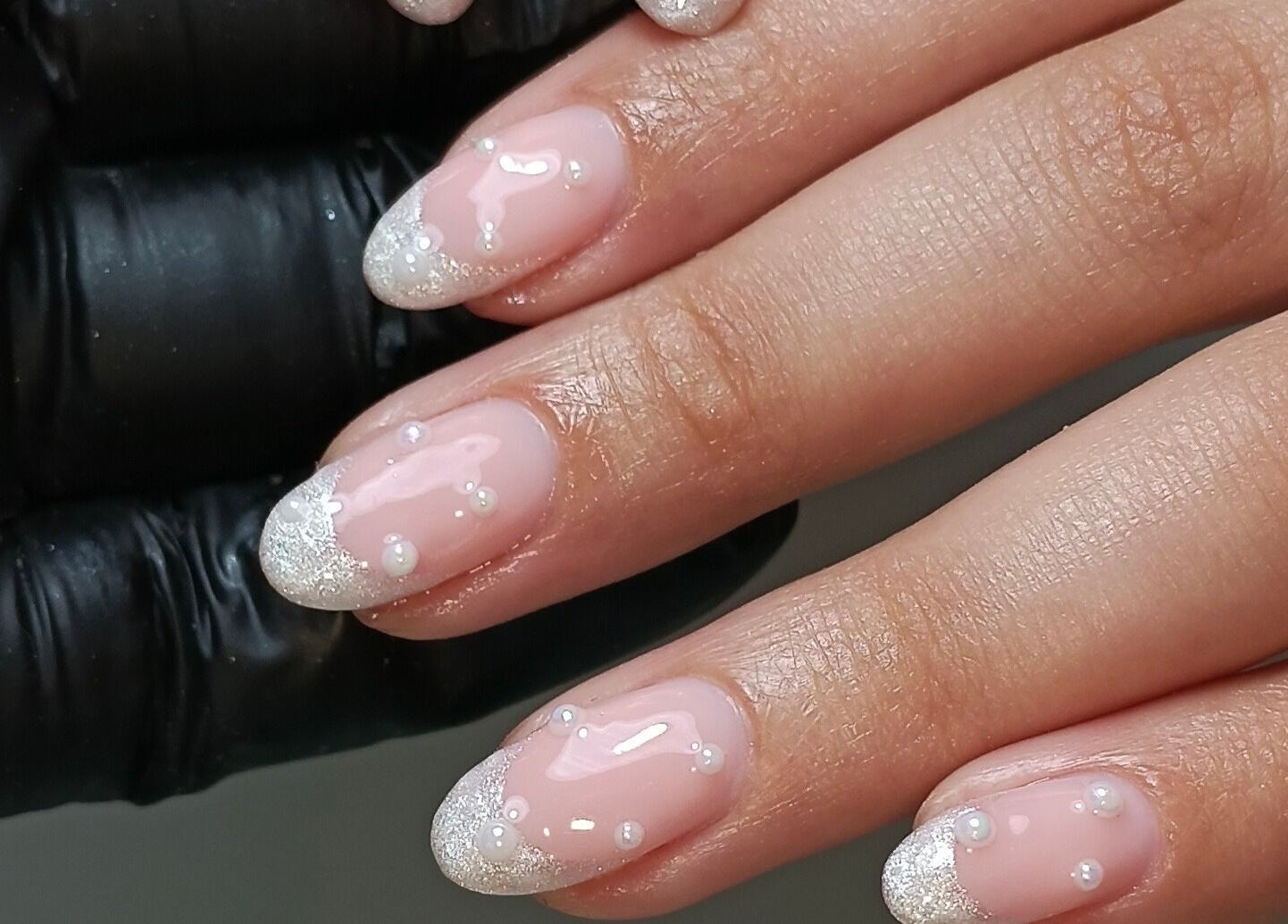 Elegant pearl-accented nails from Cocos Beauty Base in Pinetown, Kwazulu-natal, ZA.