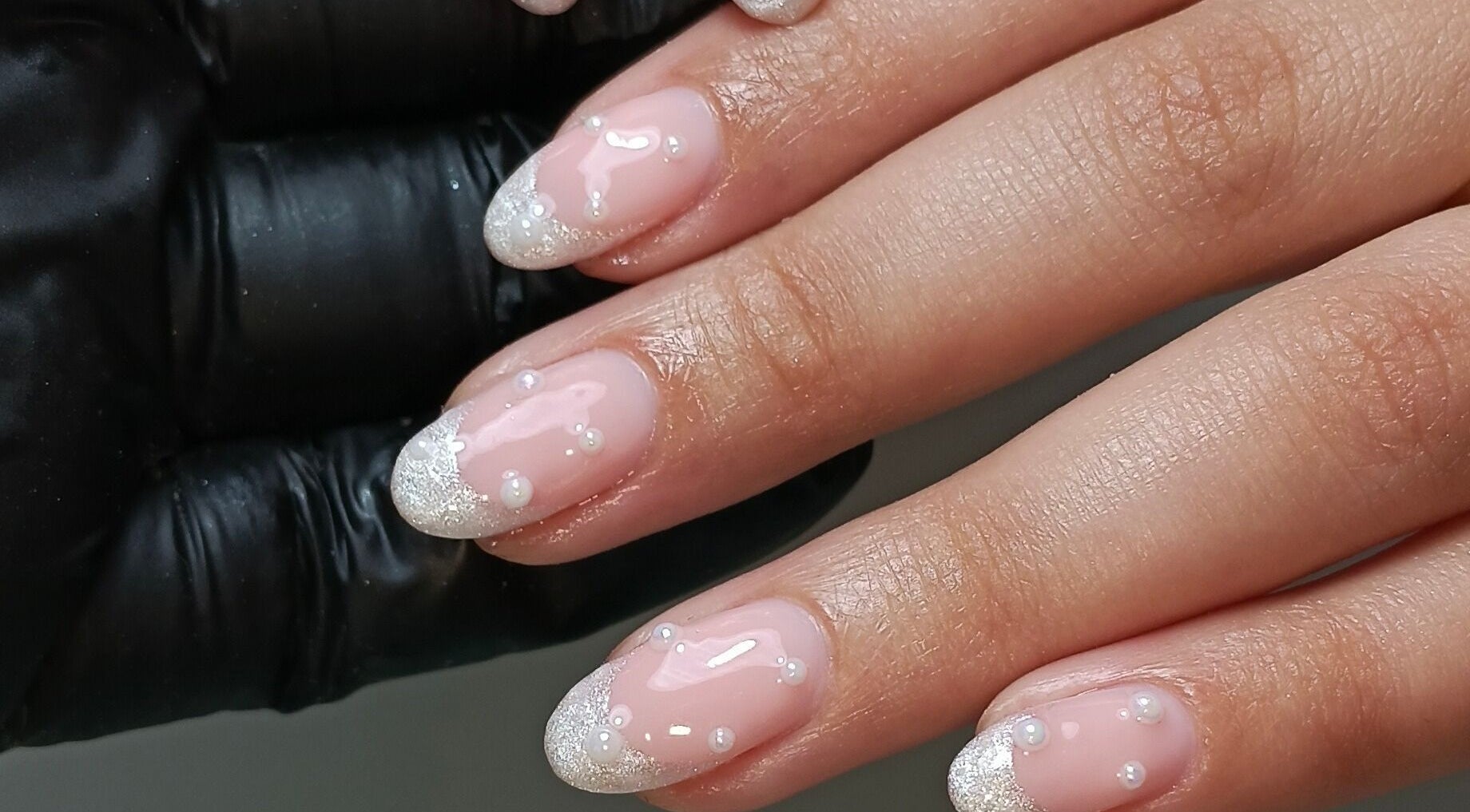 Elegant pearl-accented nails from Cocos Beauty Base in Pinetown, Kwazulu-natal, ZA.
