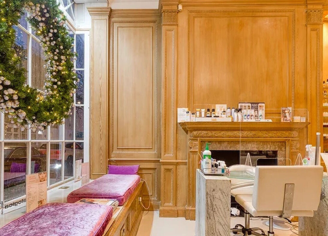 Luxurious interior of The Nail Station, London, England, GB with festive decor and premium manicure stations.