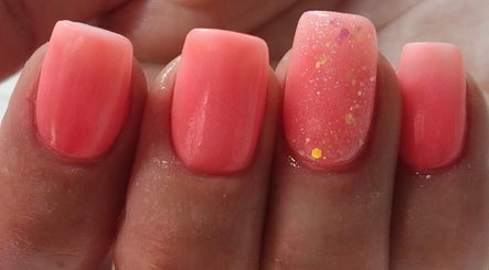 Vibrant coral nail design at Aerglo Nails & Beauty in Rustenburg, North West, ZA.