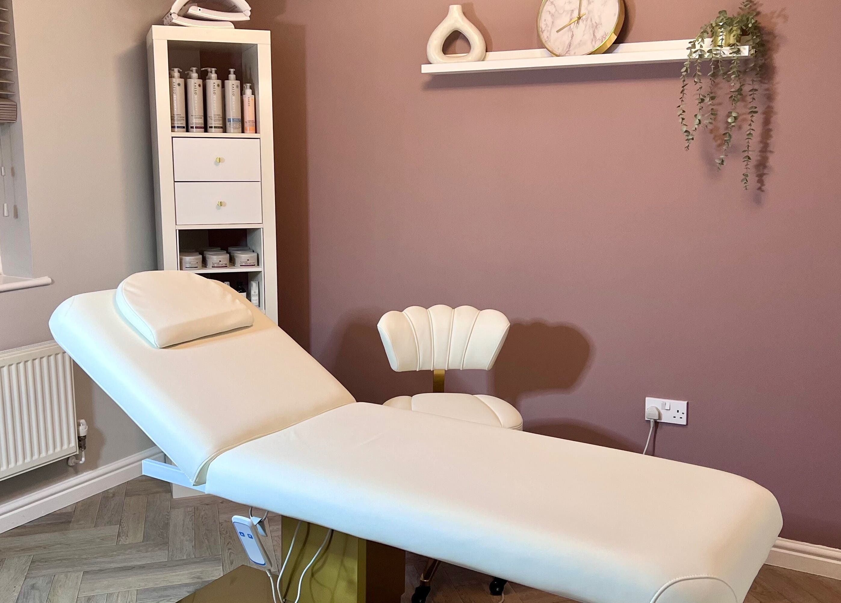 Relaxing treatment room at Skin Studio, Hirwaun, Wales, GB featuring a comfortable massage table and serene decor.