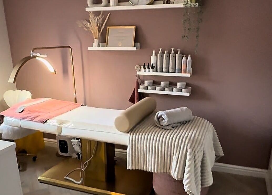 Cozy treatment room at Skin Studio in Hirwaun, Wales, GB, with a plush massage bed and elegant decor.