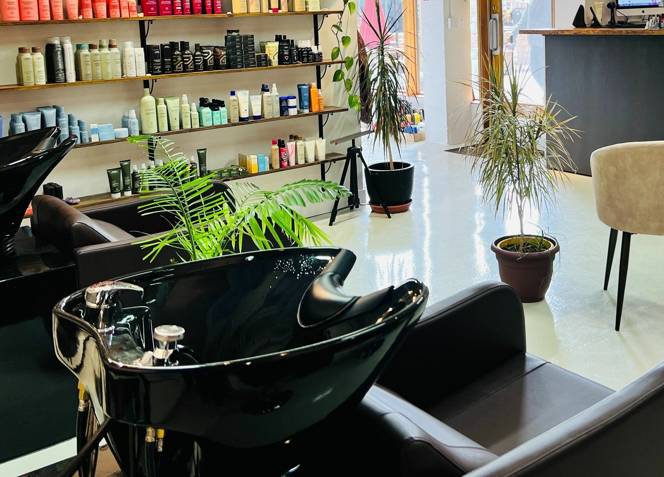 Modern salon chairs and hair product shelves at Botega Salon and Gallery, Banff, Alberta, CA.