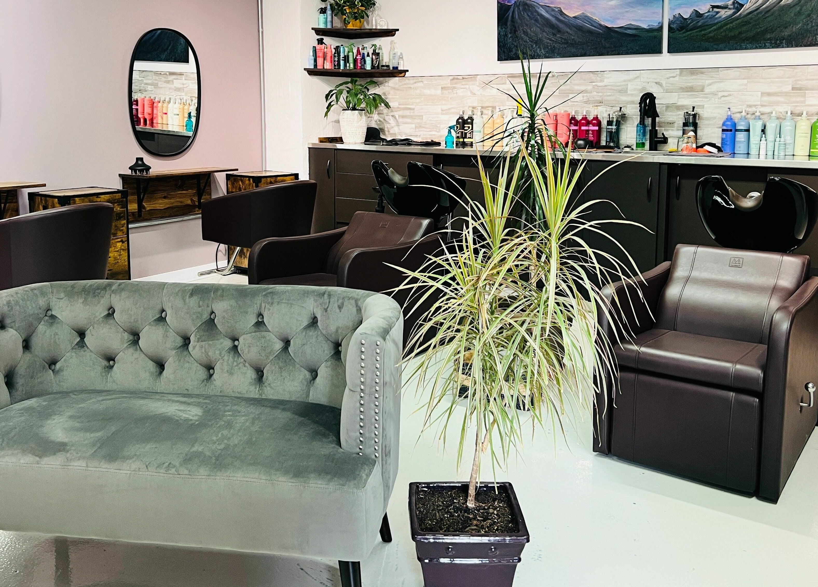 Elegant seating and hair stations at Botega Salon and Gallery, Banff, Alberta, CA, showcasing modern decor.